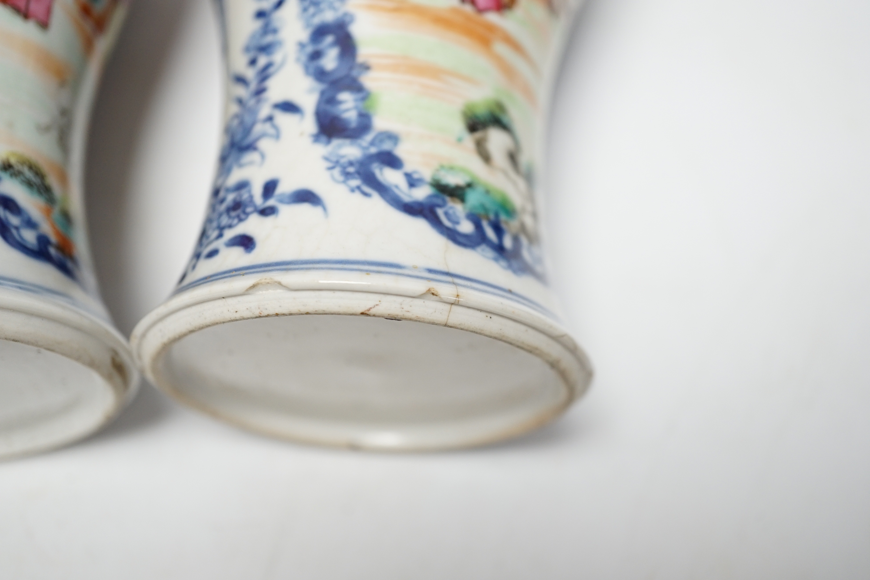 A pair of late 18th century Chinese famille rose ‘mandarin’ vases, 19cm high